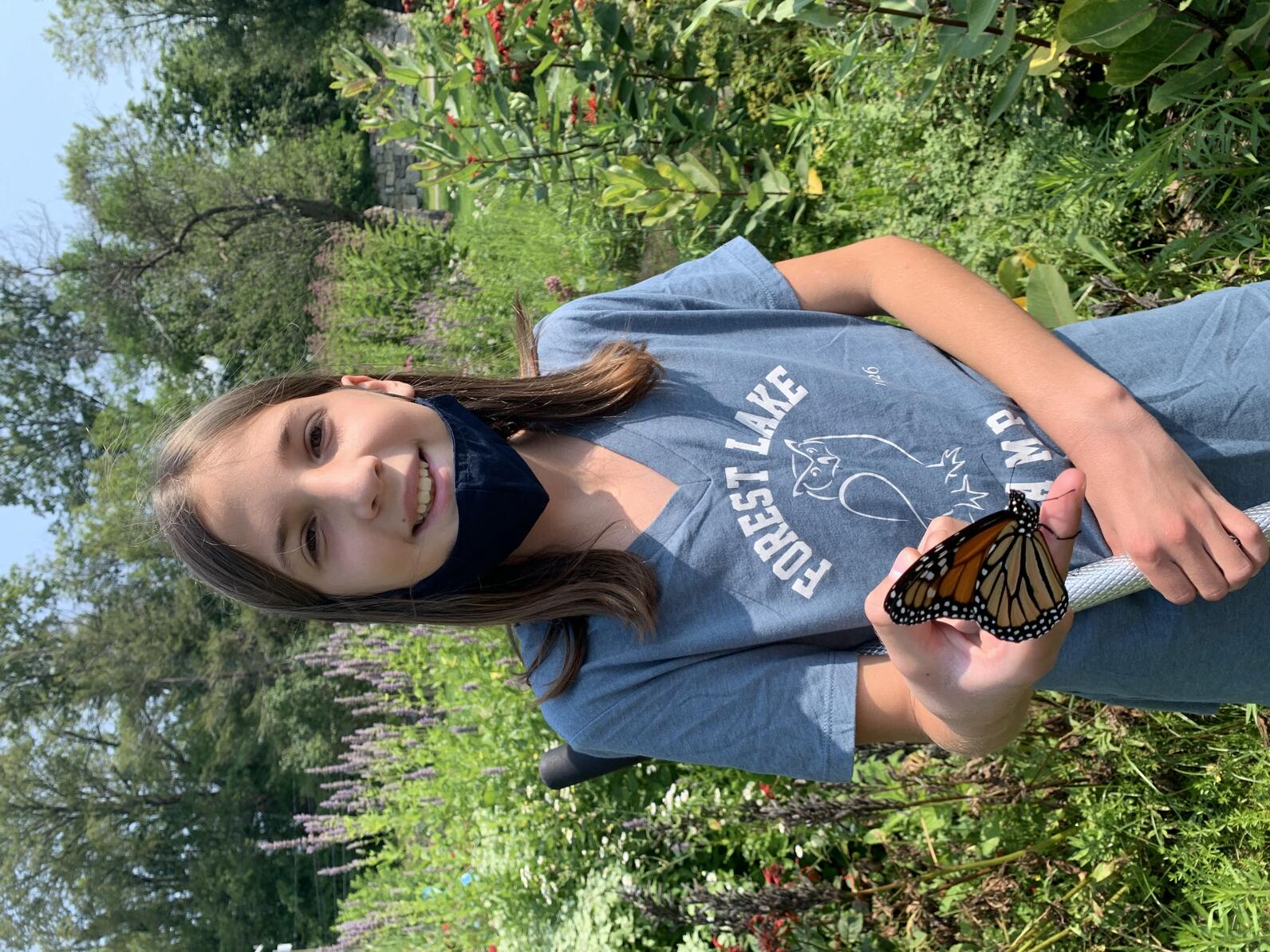 Girl holding butterfly 
